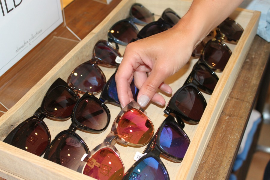 hand holding sunglasses 