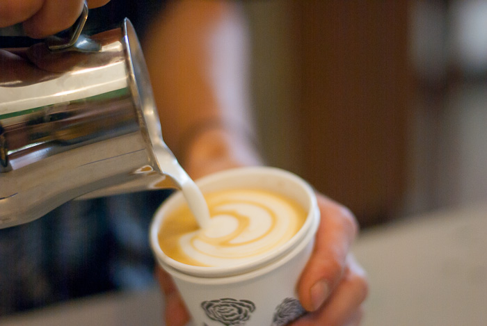 barista making coffee from one of the best Chicago area coffee shops