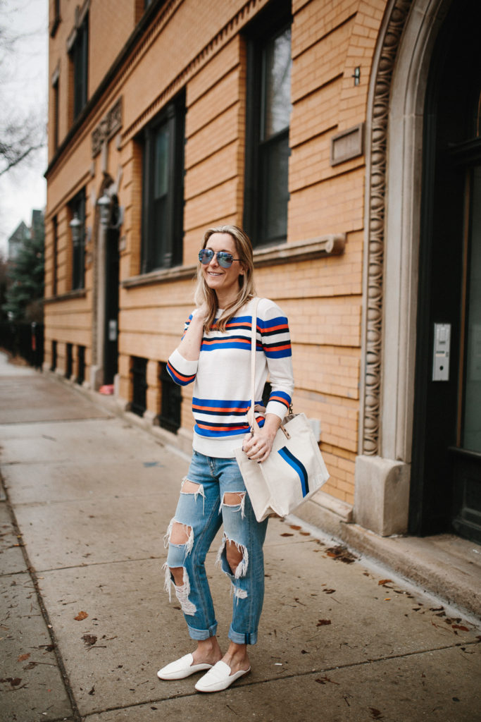 Megan Medica is wearing a Striped Sweater, Distressed Boyfriend Jeans and White Mules