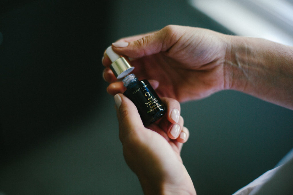 woman's hands holding a Clean Beauty Brands
