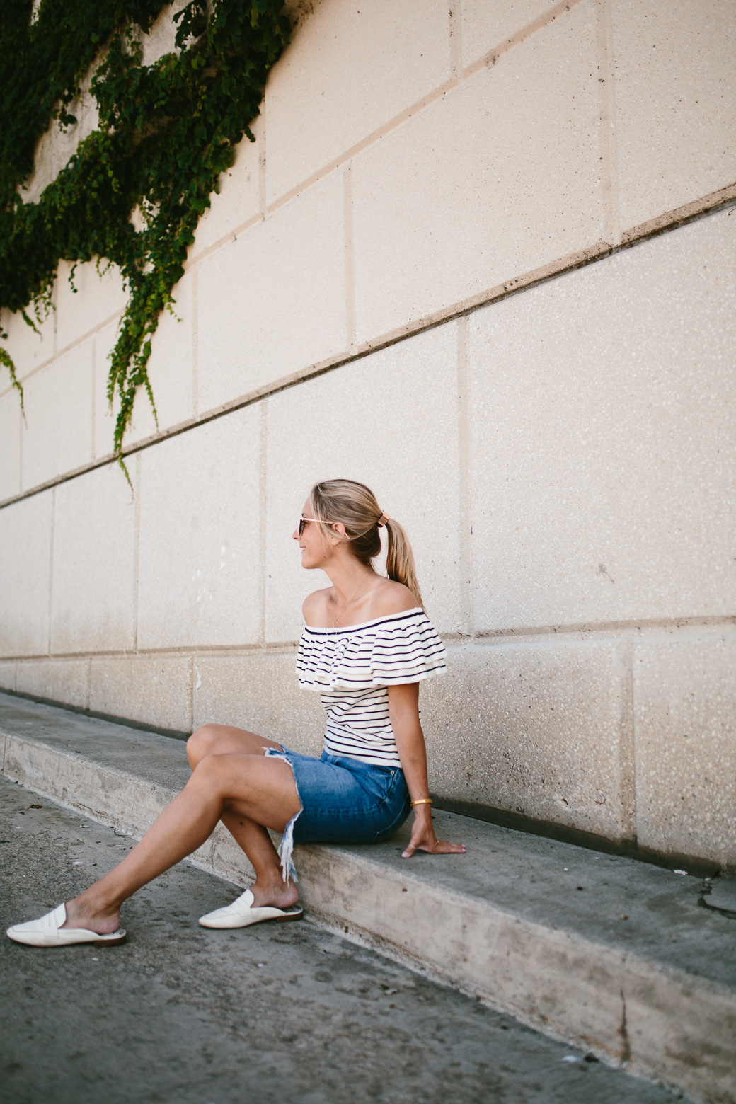 woman in denim skirt and sitting 