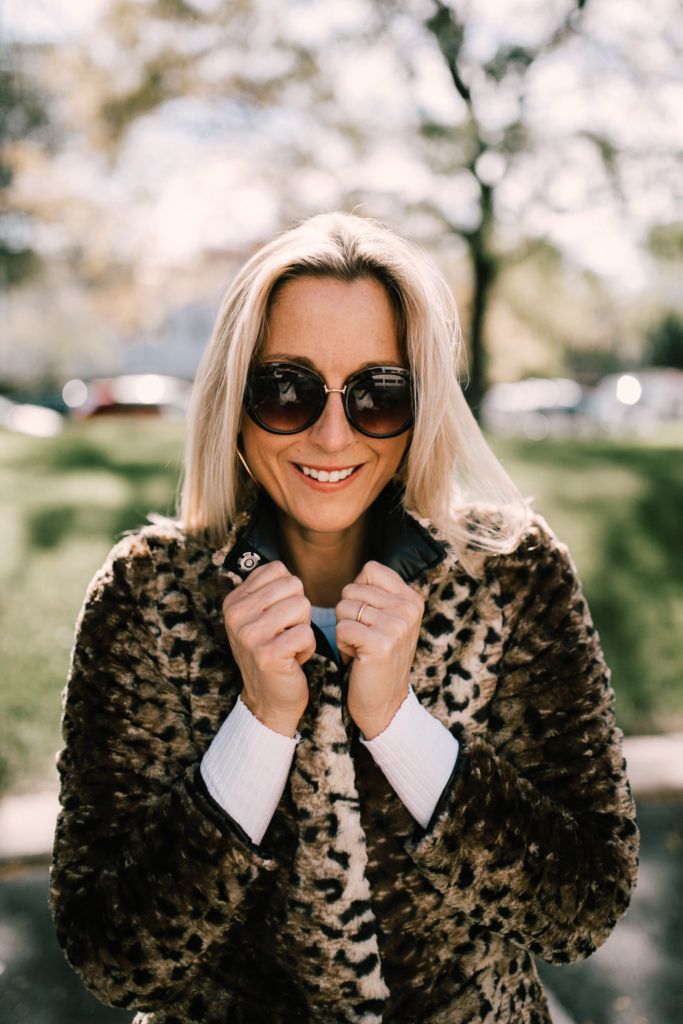 woman wearing Leopard Print Coat for the Holiday Season which is under $200
