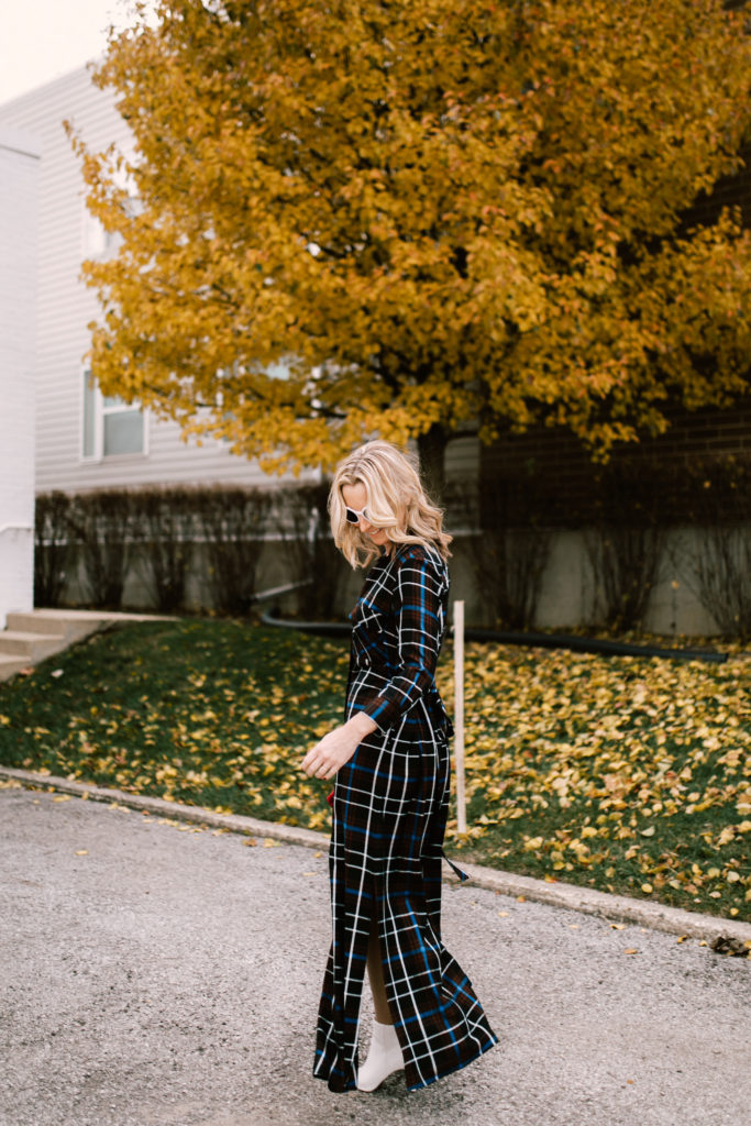 woman sharing how to wear a plaid maxi dress 