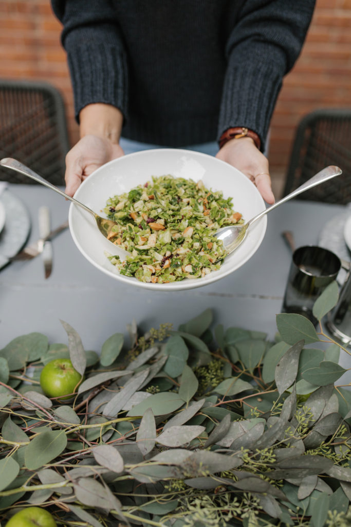 hands holding a meal from one of the Fall Entertaining Recipes