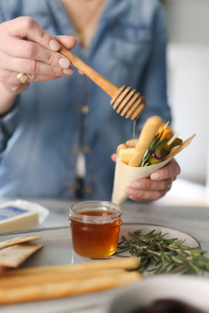 hand held cups with finger food