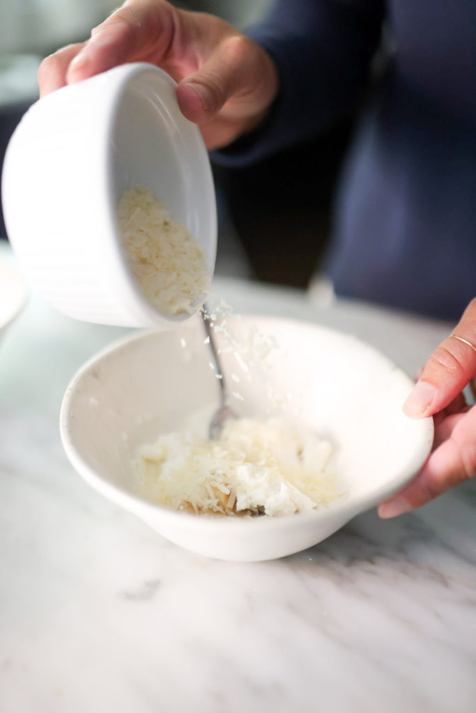 person mixing Four Cheese & Truffle Honey